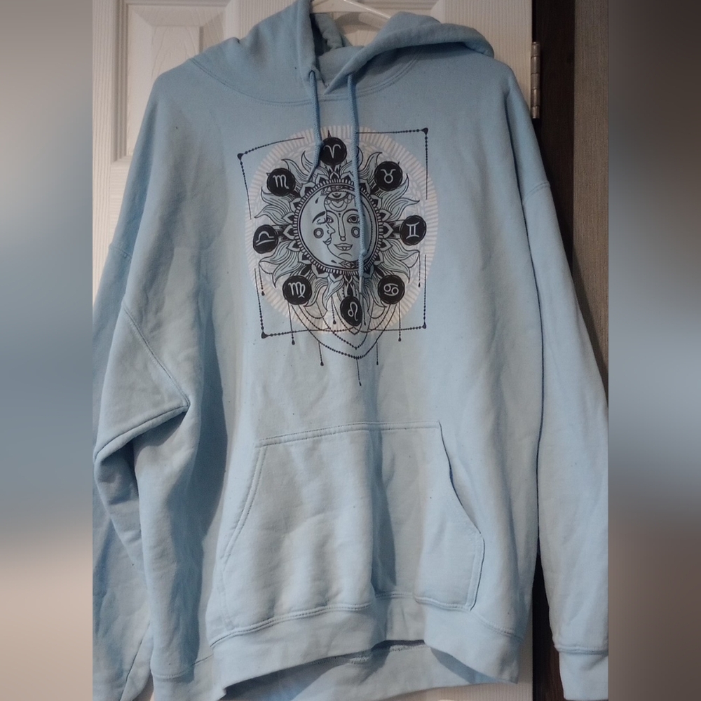 Blue sun and moon Gildan hoodie with astrology design